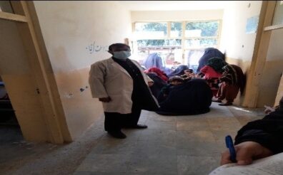 Community elders construct a waiting room for visitors in a Laghman health center